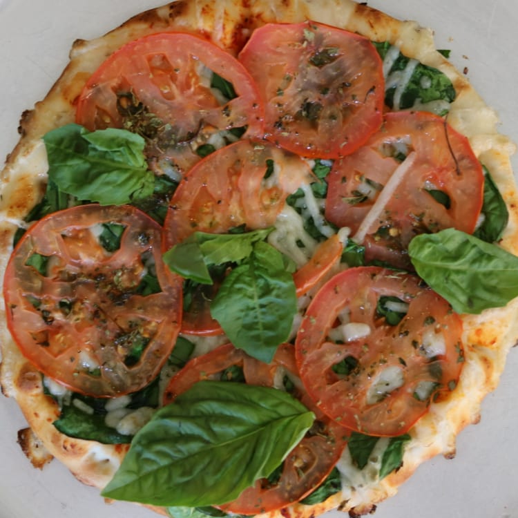 Spinach and Tomato Pizza.
