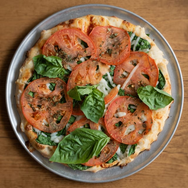 Spinach and Tomato Pizza.